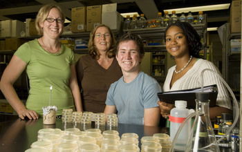 Stevens, high school biology teacher Terri Hale and two high school students